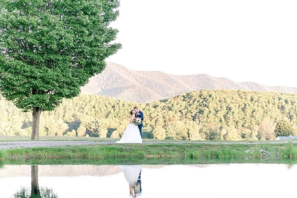 Wide banner view across the pond and meadow to the mountain ridge at Scottland Farm